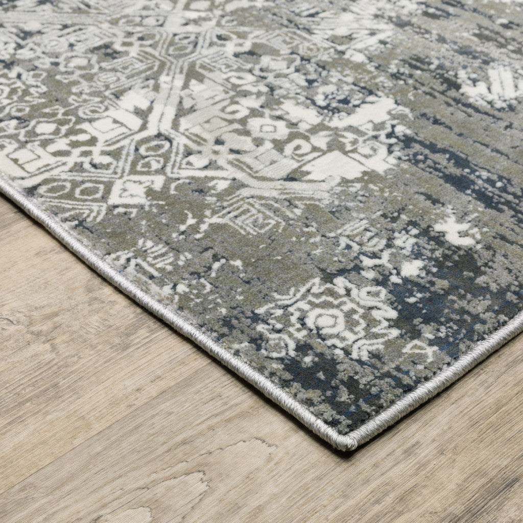 6' X 9' Ivory Grey Blue And Taupe Abstract Power Loom Stain Resistant