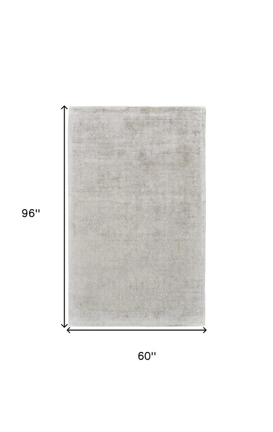 5' X 8' Gray and Ivory Abstract Hand Woven Area Rug