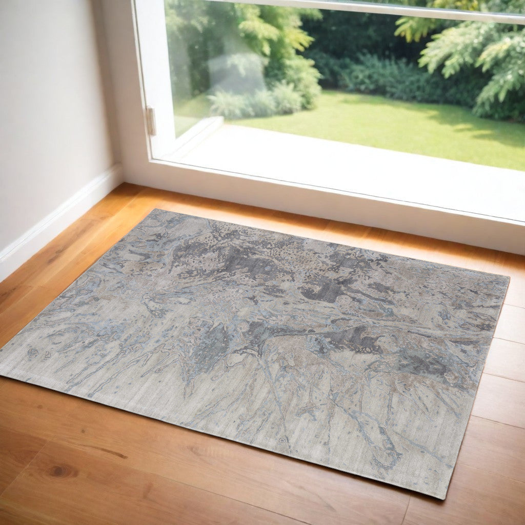 4' X 6' Ivory Taupe and Green Abstract Hand Tufted Worn Faded Area Rug