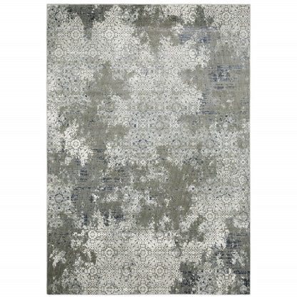6' X 9' Ivory Grey Blue And Taupe Abstract Power Loom Stain Resistant