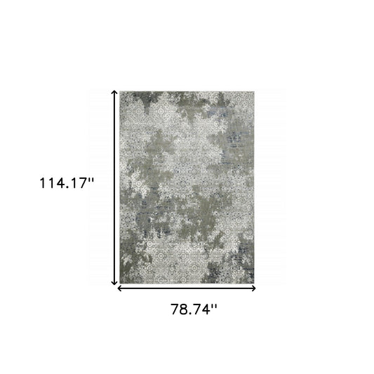 6' X 9' Ivory Grey Blue And Taupe Abstract Power Loom Stain Resistant